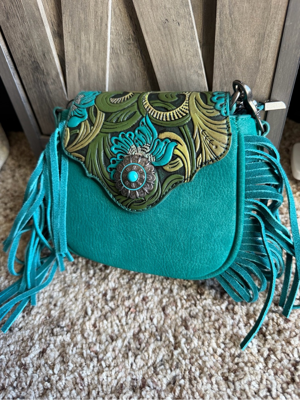 Teal Fringe Crossbody Bag with Embossed Floral Flap by Montana West
